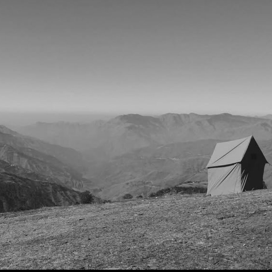 Tent overlooking mountain valley