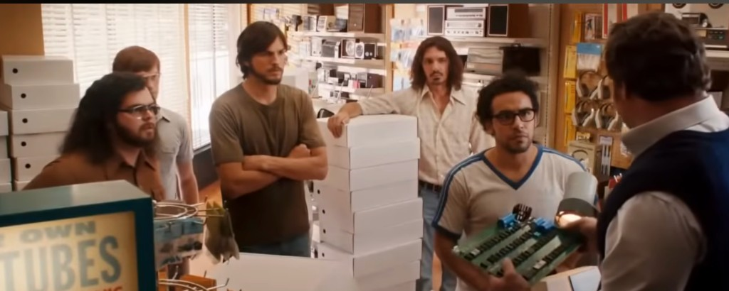 Scene from Jobs — circuit board and customer feedback
